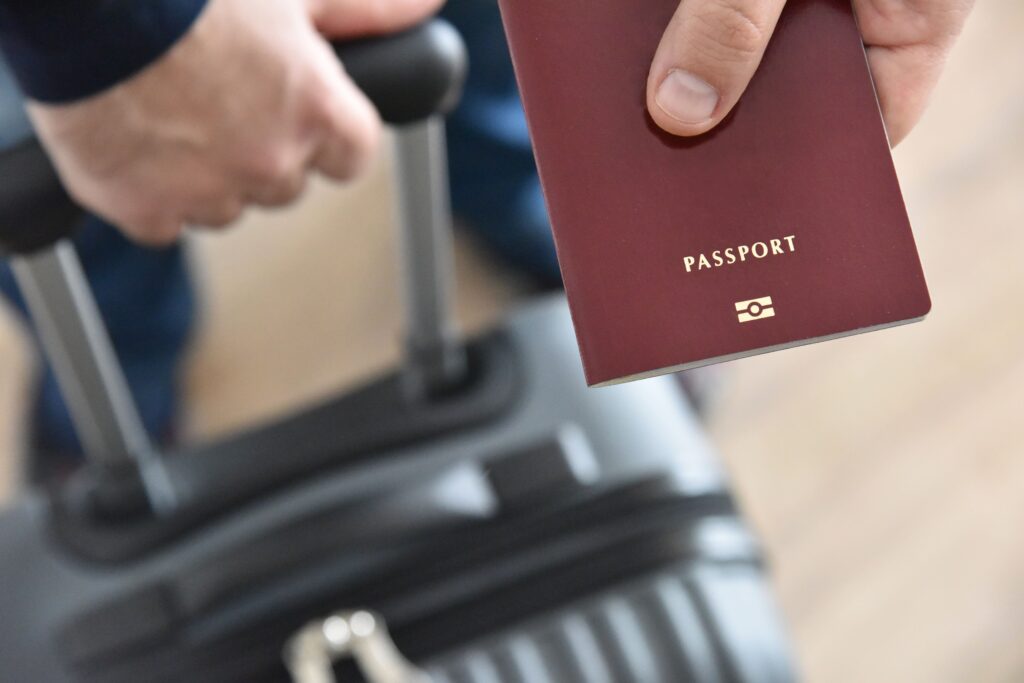 Creating a Travel Itinerary - close up of a red passport